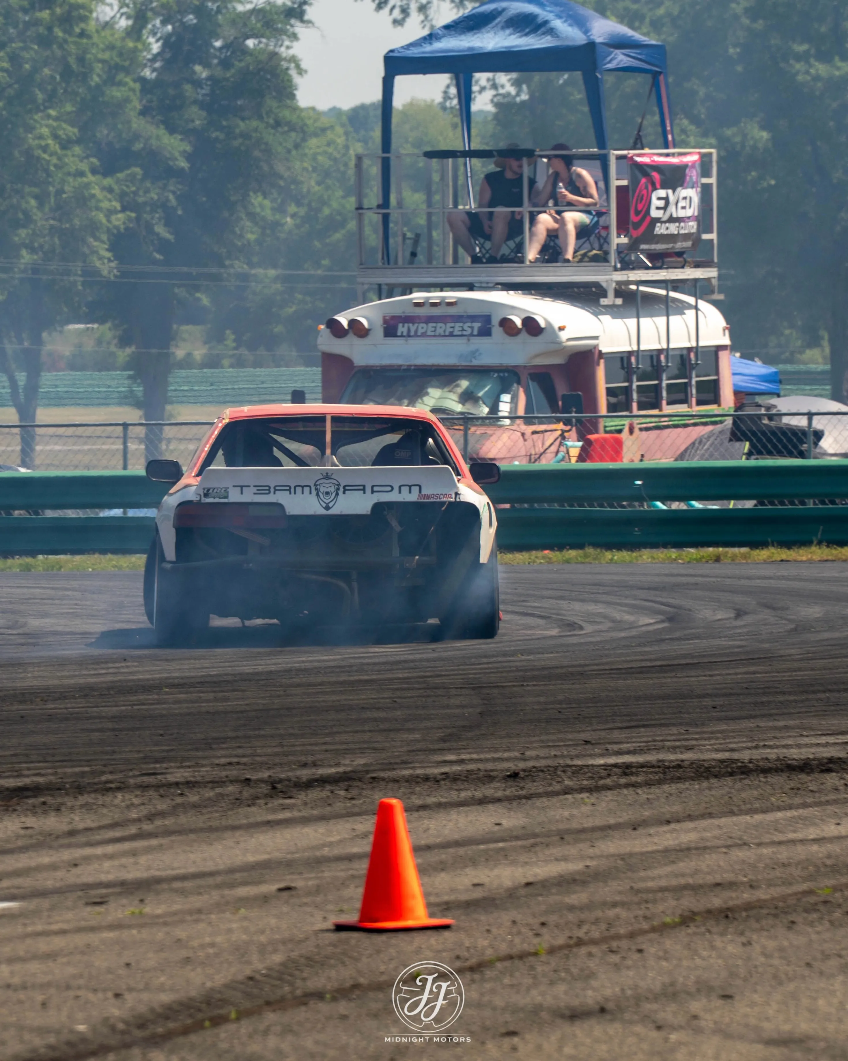 Number 185 S-chassis sliding through a corner at VIR