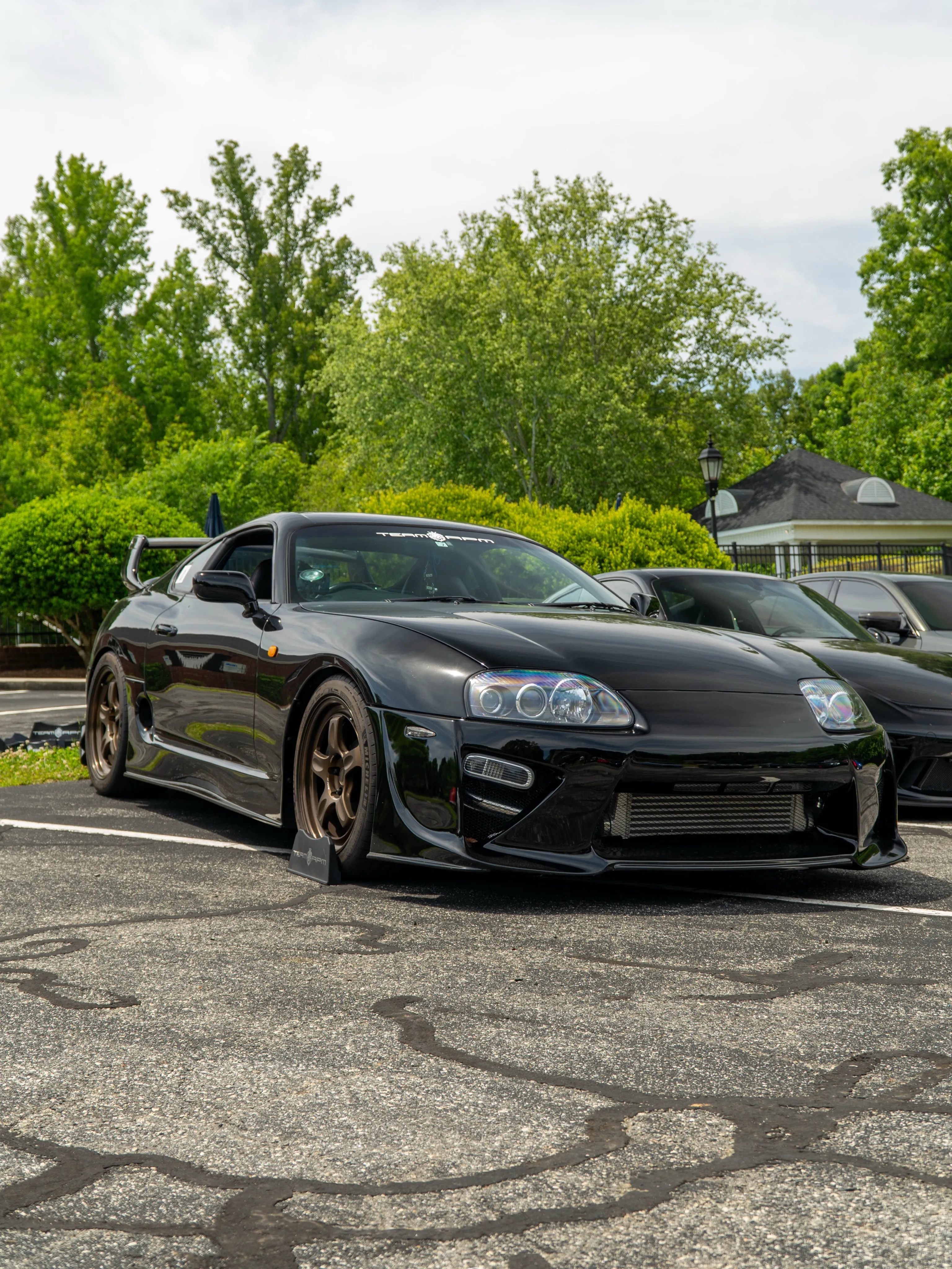 Black Toyota Supra MK4 at an outdoor meet