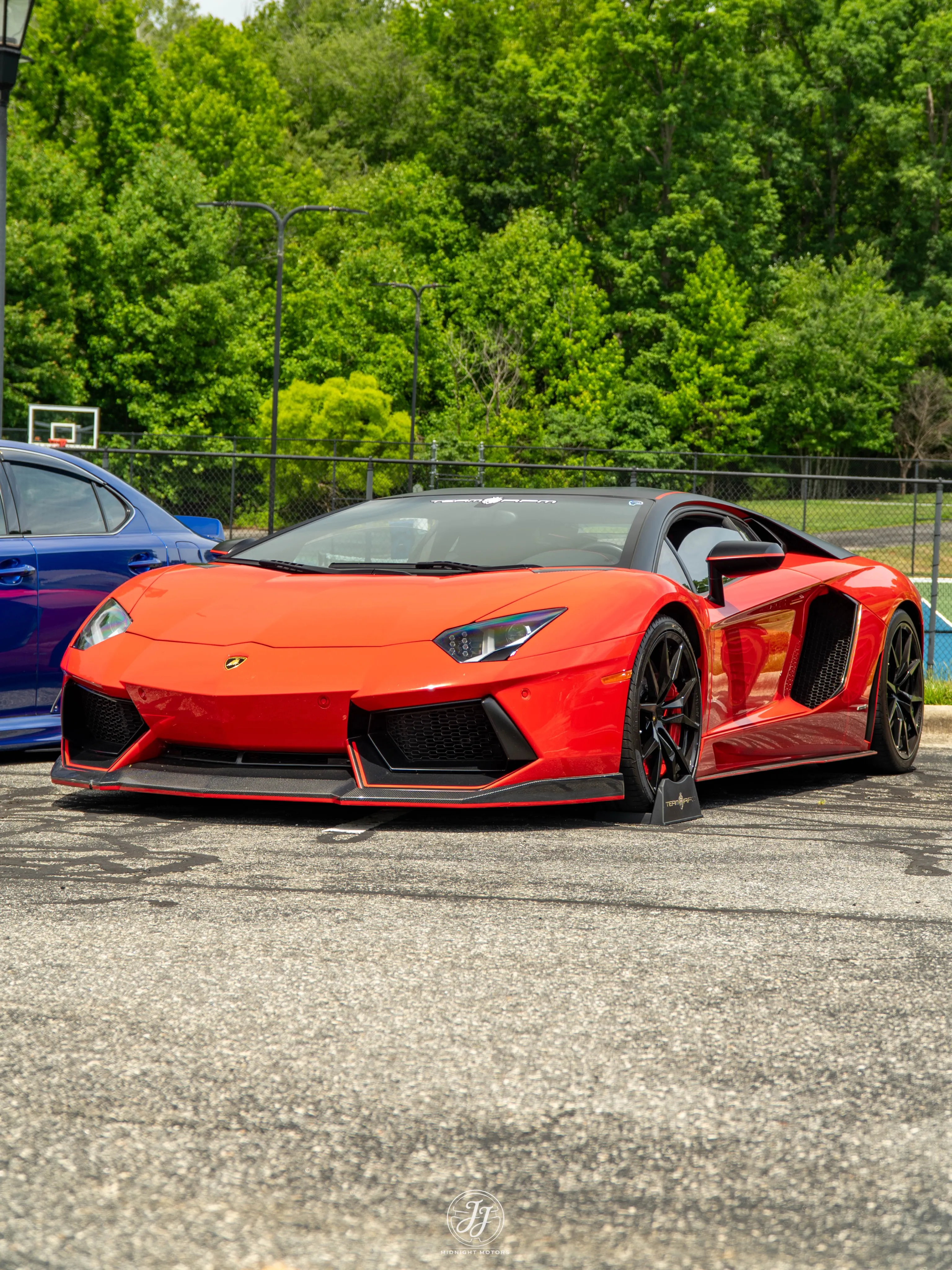 Red Lamborghini Aventador LP 700-4 Pirelli Edition with TEAM RPM windshield banner